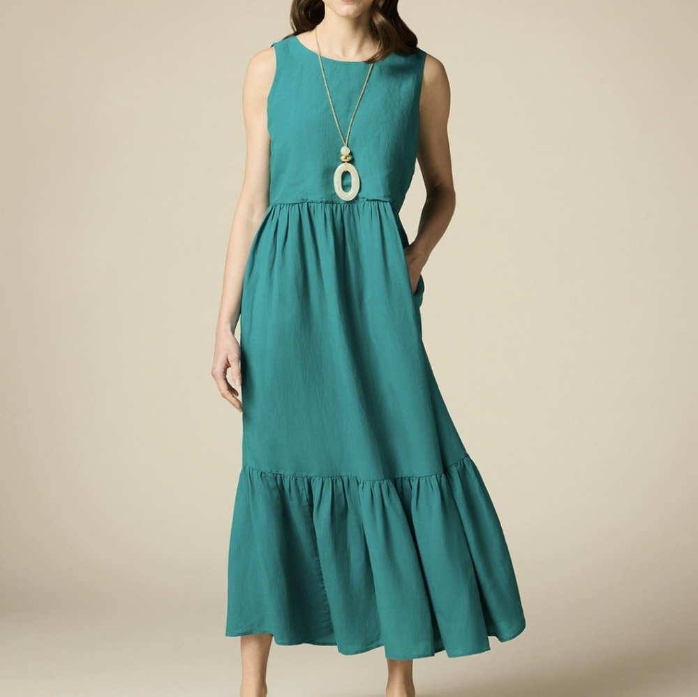 Japra Sleeveless Green midi Dress with Side Cutouts and an Open Back.